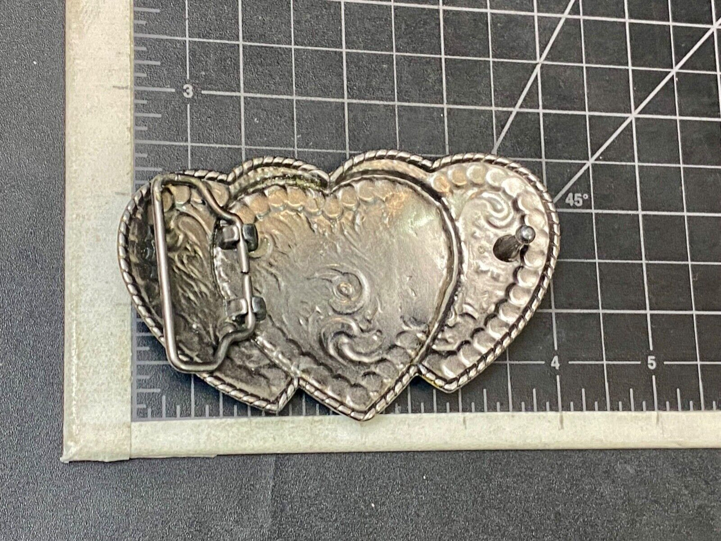 Three hearts ornate flower swirl belt buckle with thick rhinestone boarder