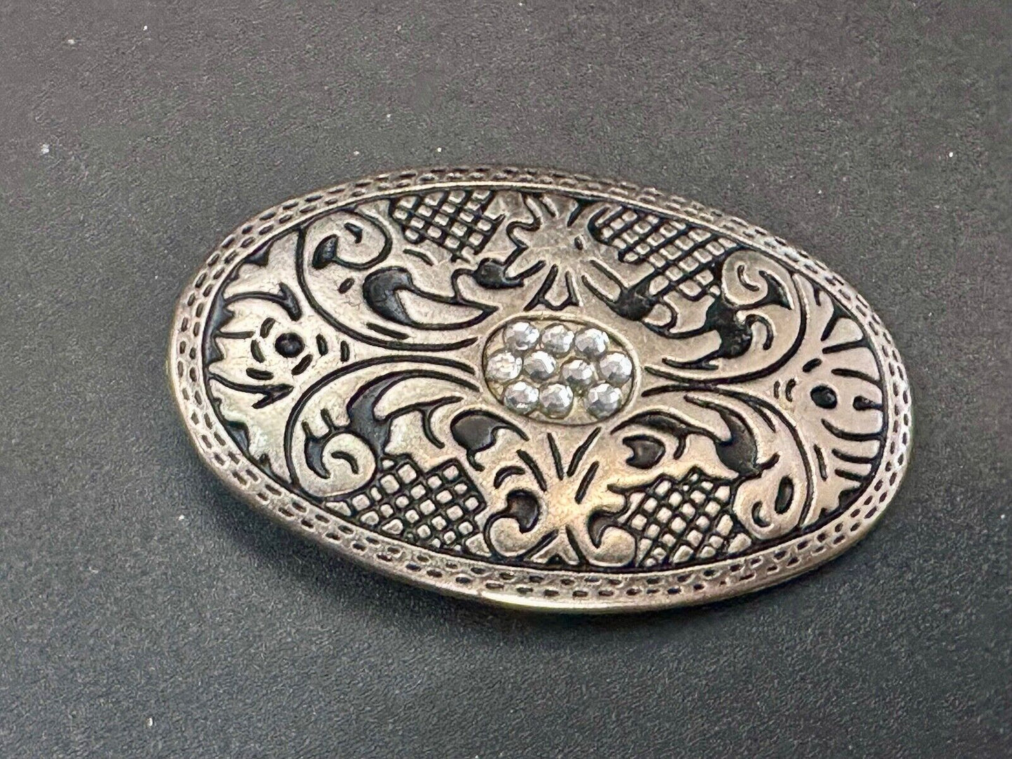 Vintage Cluster Centered in southwestern pattern oval belt buckle