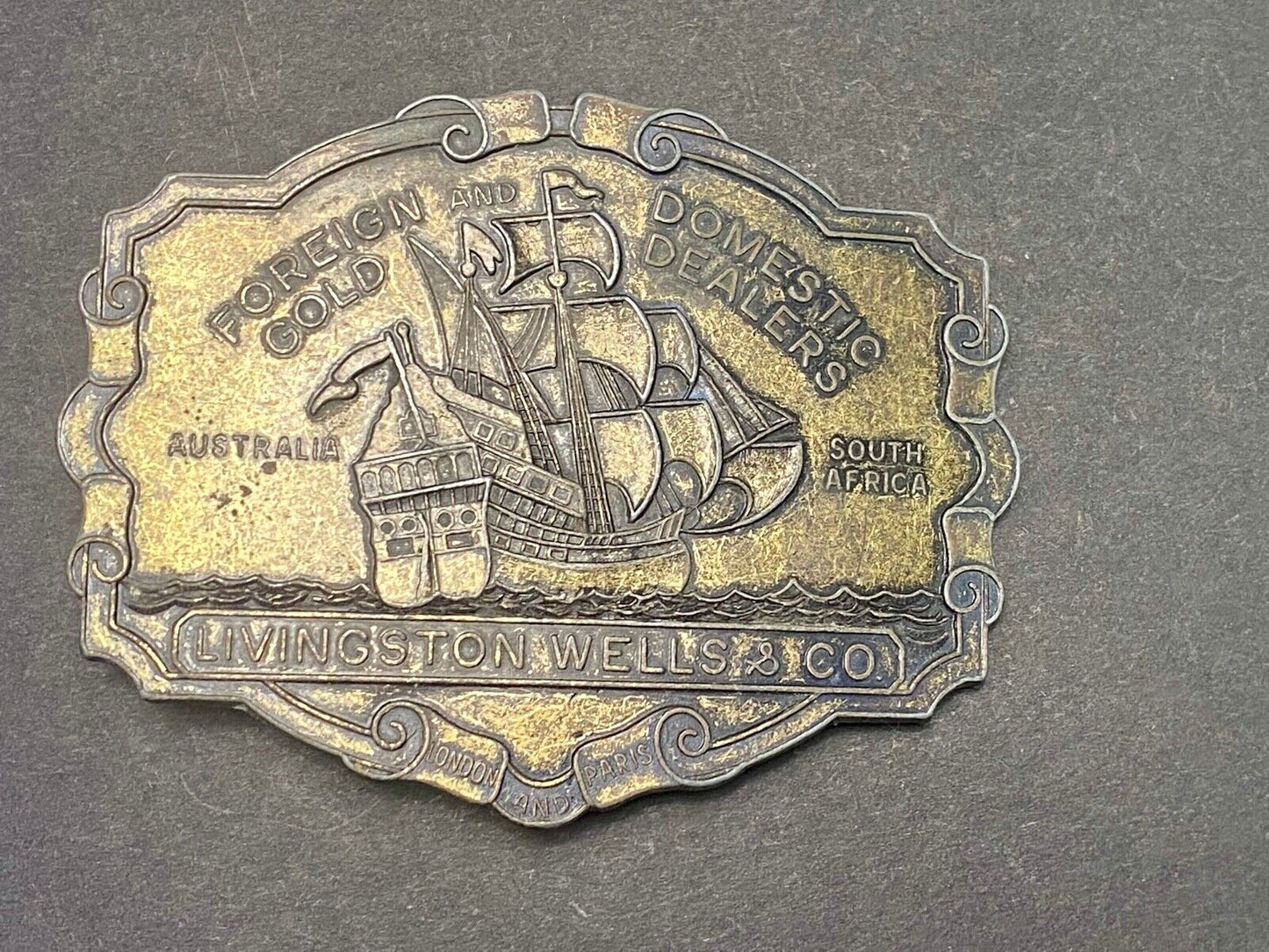 VINTAGE ANTIQUE METAL BELT BUCKLE- Livingston Wells & Co Sailboat Ship
