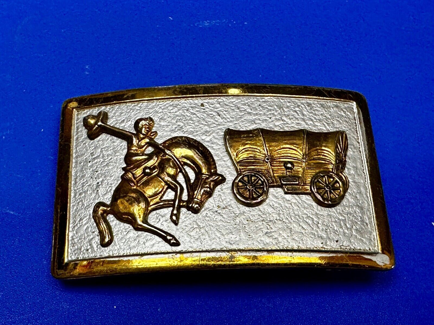Vintage Cowboy Saddle Bronc western Covered wagon gold tone belt buckle