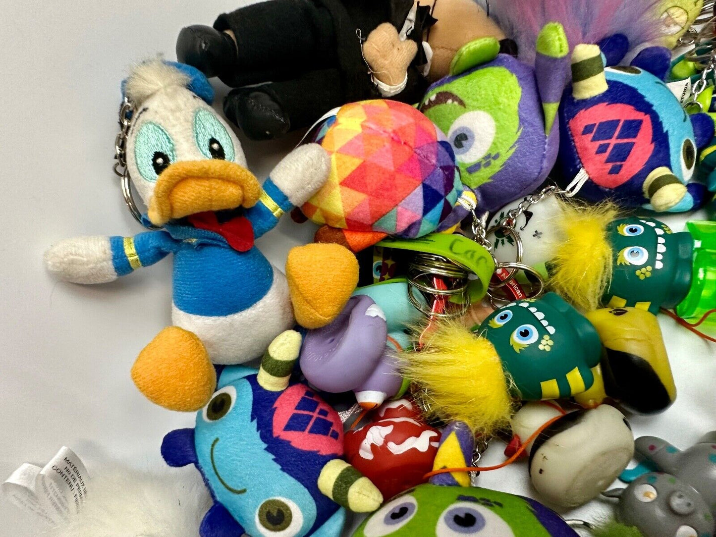 Around 75 plush doll Keychains Resale Bulk Lot, Junk Drawer Grab Bag