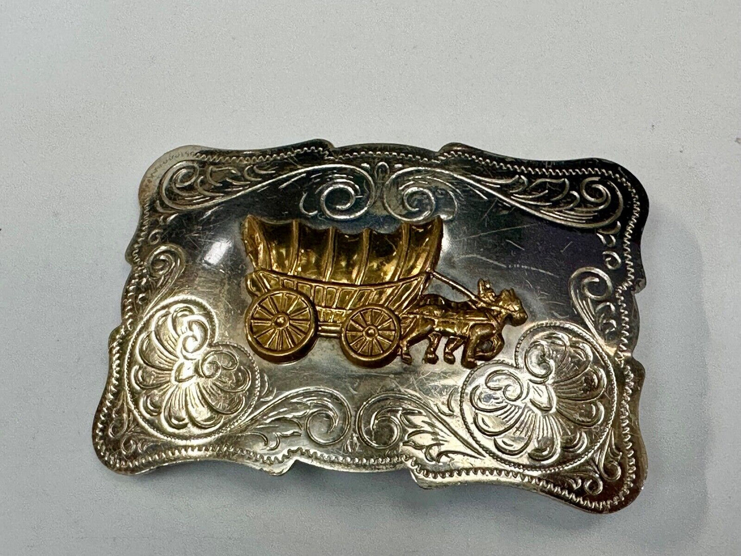 Vintage Covered Wagon two tone ornate cowboys out west flower swirl belt buckle