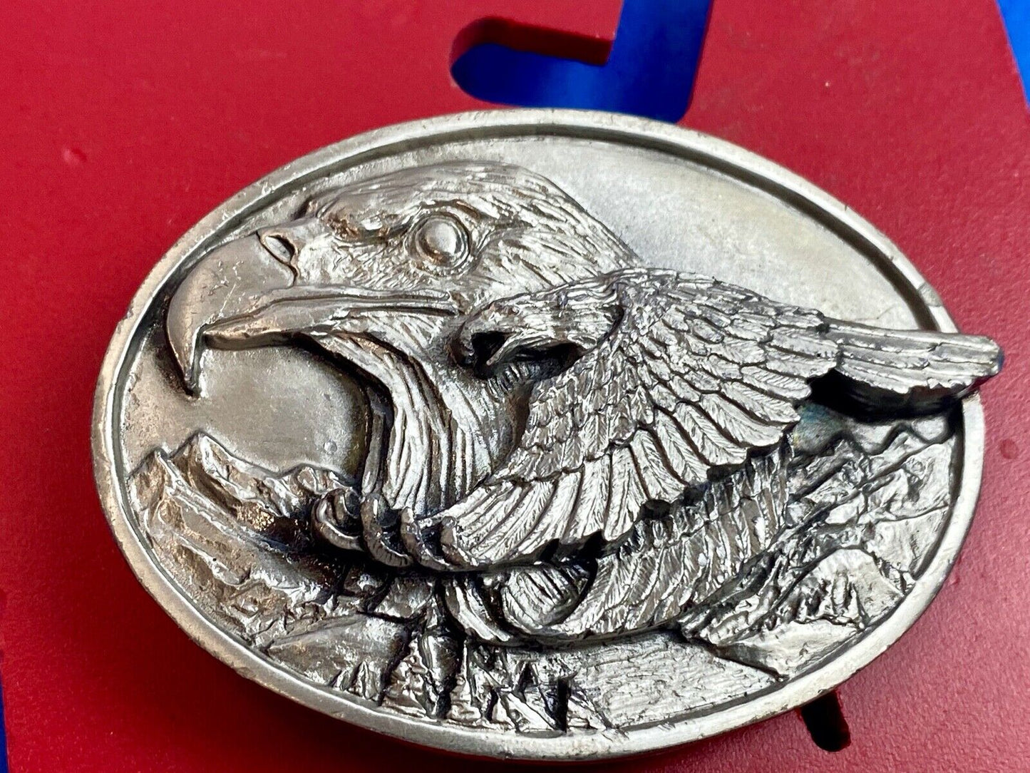 big cabin eagle head bust over mountains nature belt buckle on card