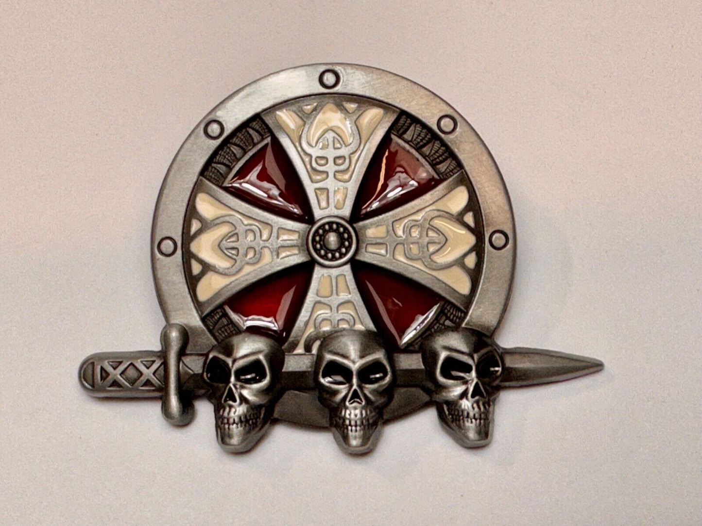 Three skulls with sword through heads on Iron Cross round NOS belt buckle
