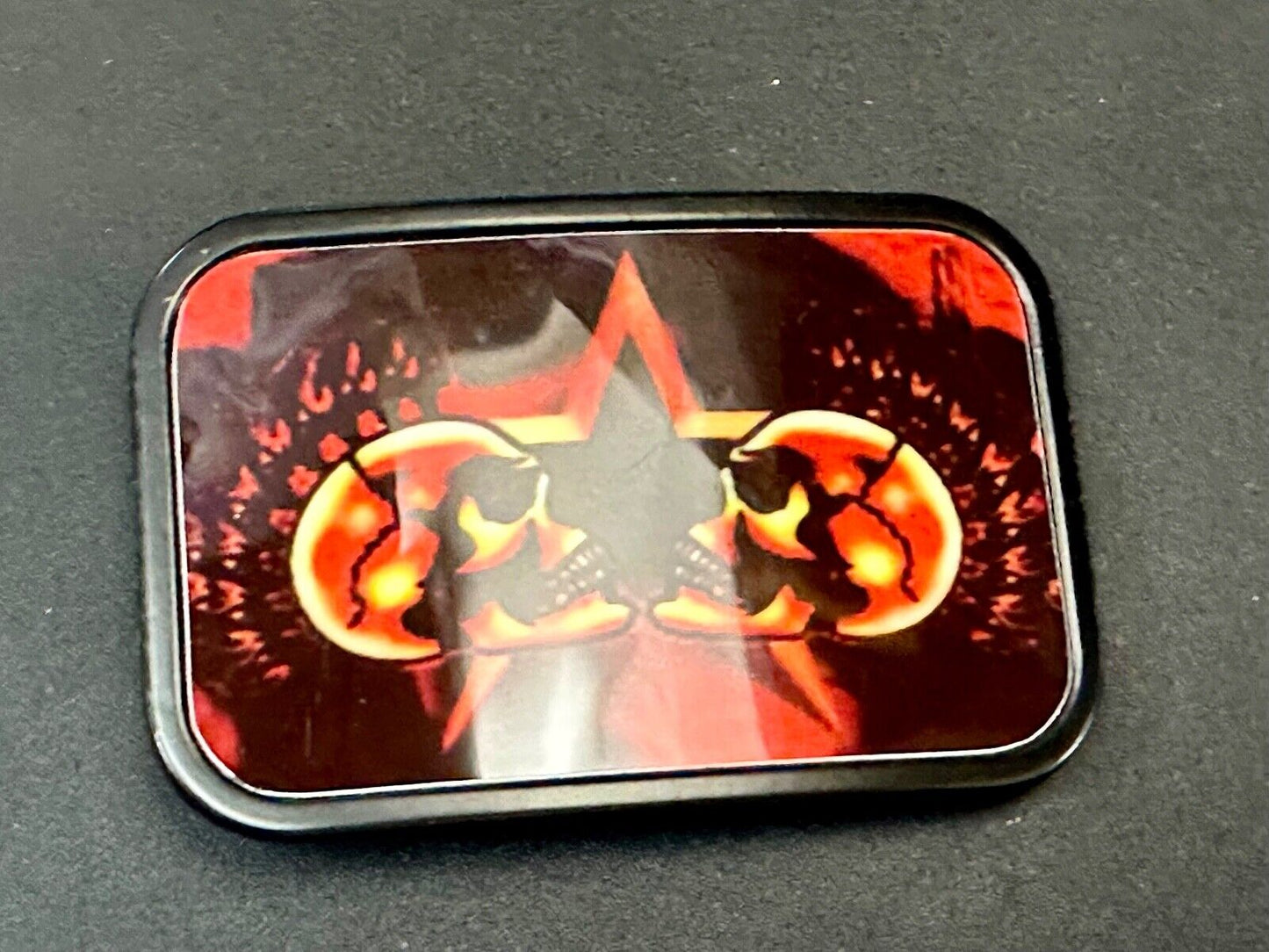 Two Skulls around star picture - black & red color rectangular belt buckle