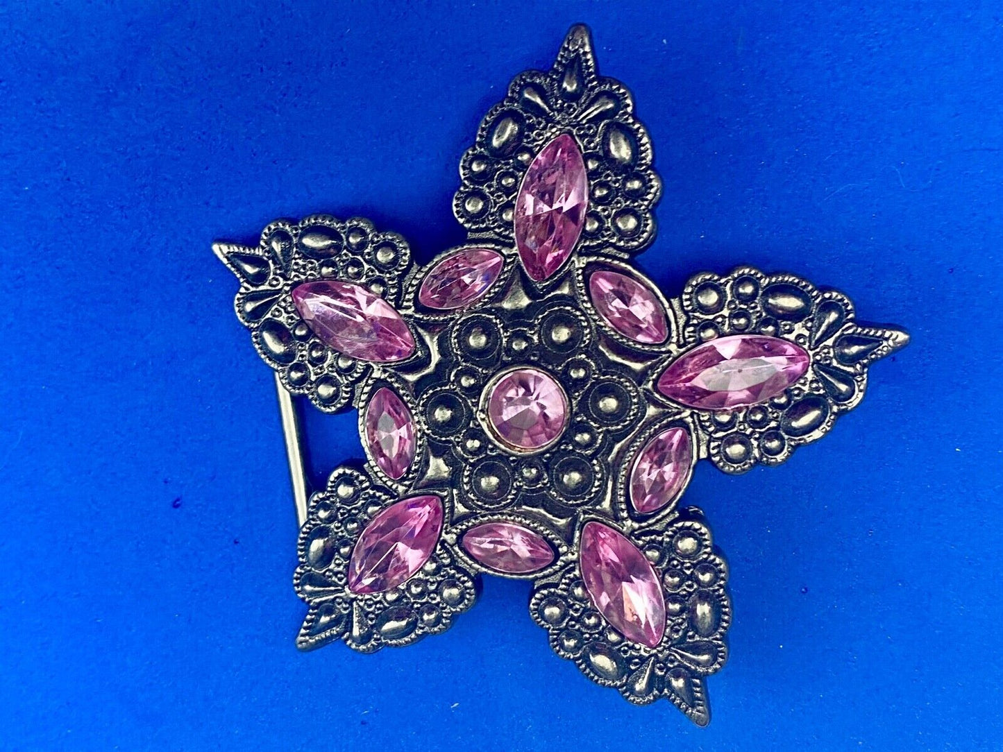 Beautiful figural star with pink accent rhinestones