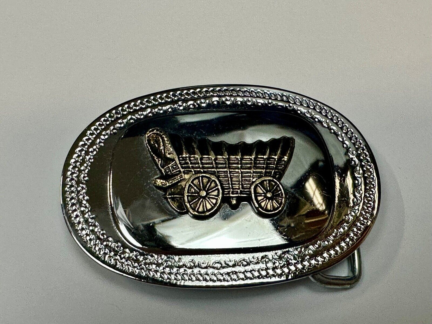 Vintage Covered Wagon on reflective oval two tone western belt buckle