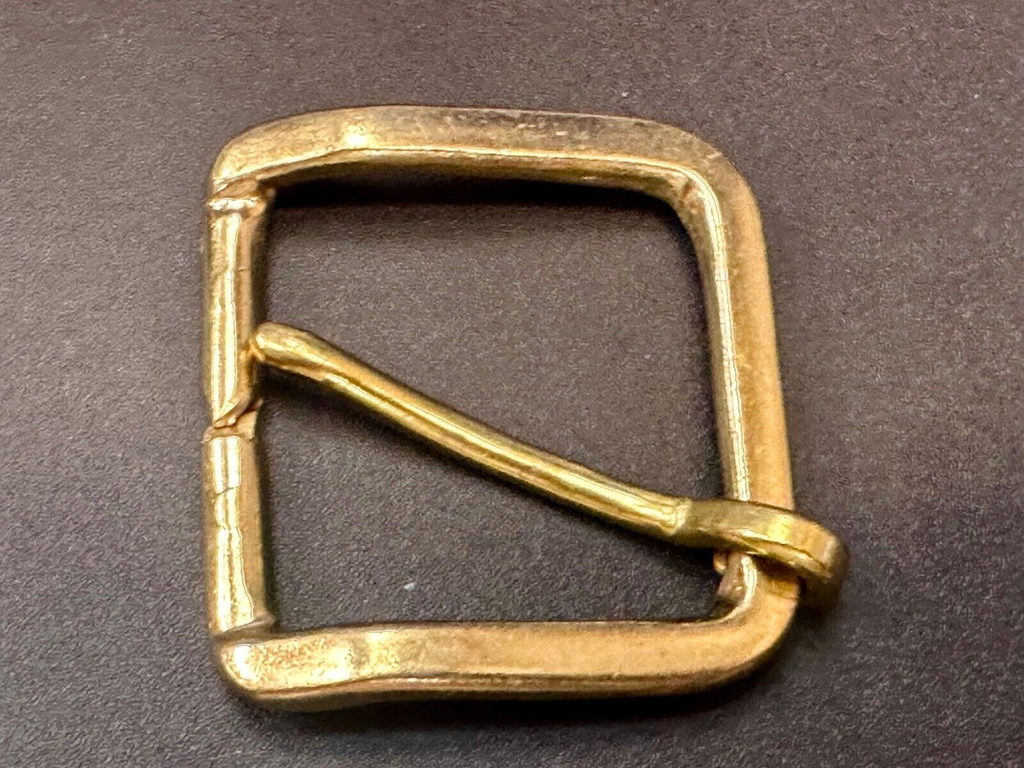 Vintage replacement belt buckle marked W with unique angle