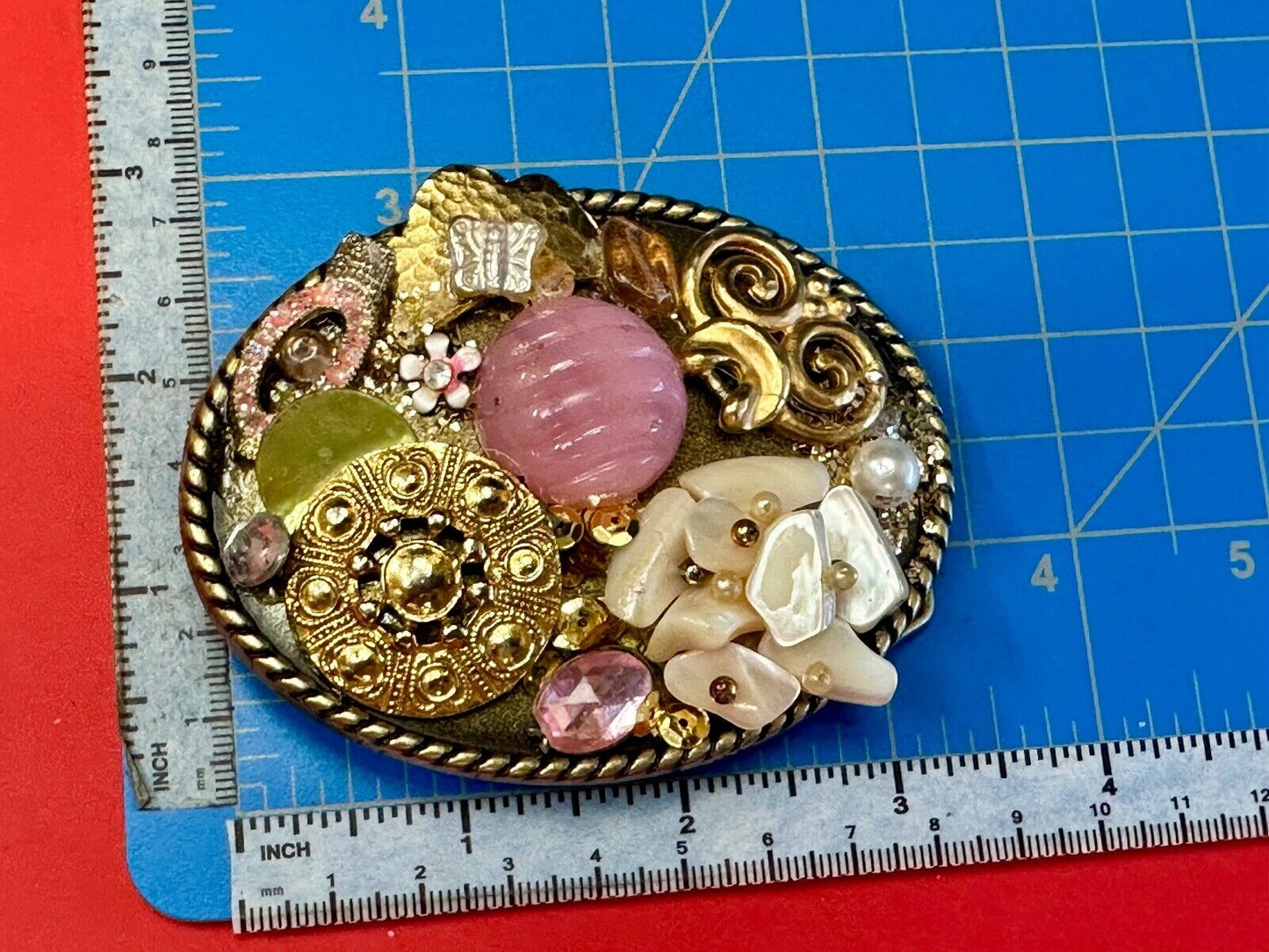 Artisan Abstract flowers made of mixed material on gold tone oval belt buckle