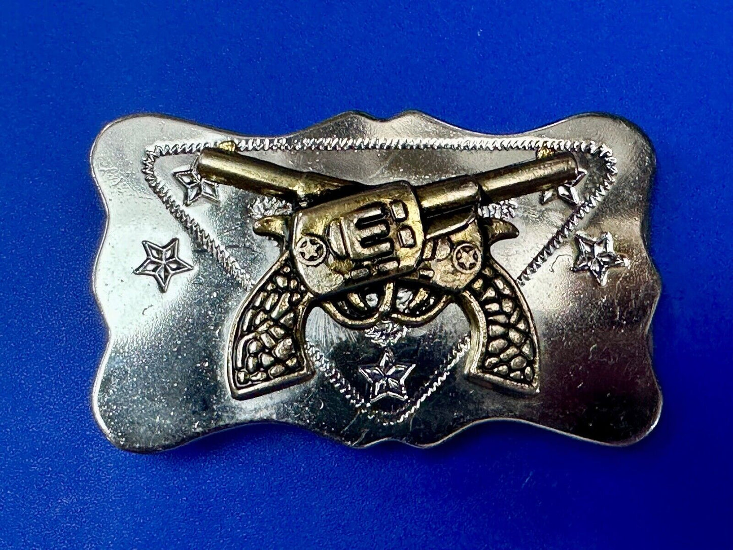 Vintage Cowboys Six Shooter gun's crossed western two tone belt buckle