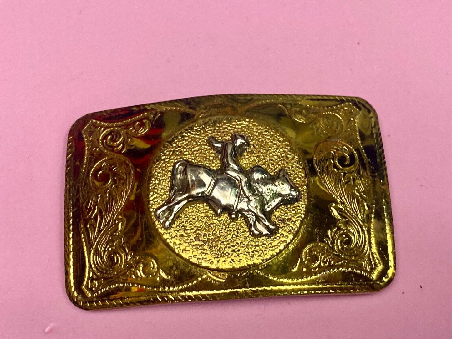 Beautiful ornate solid brass rodeo cowboy on rectangular western belt buckle