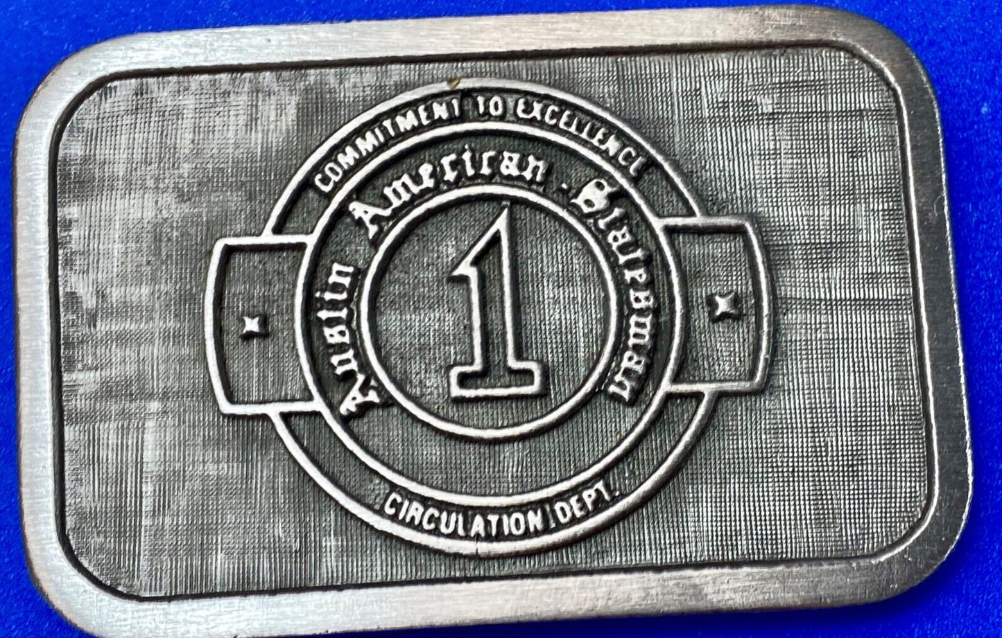 Asian American Circulation Dept Commitment to excellence belt buckle hit-line