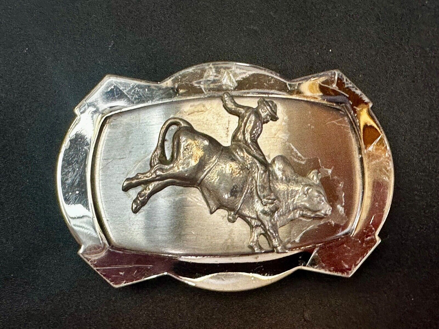 Vintage Cowboy Saddle Bronc on reflective two tone western belt buckle