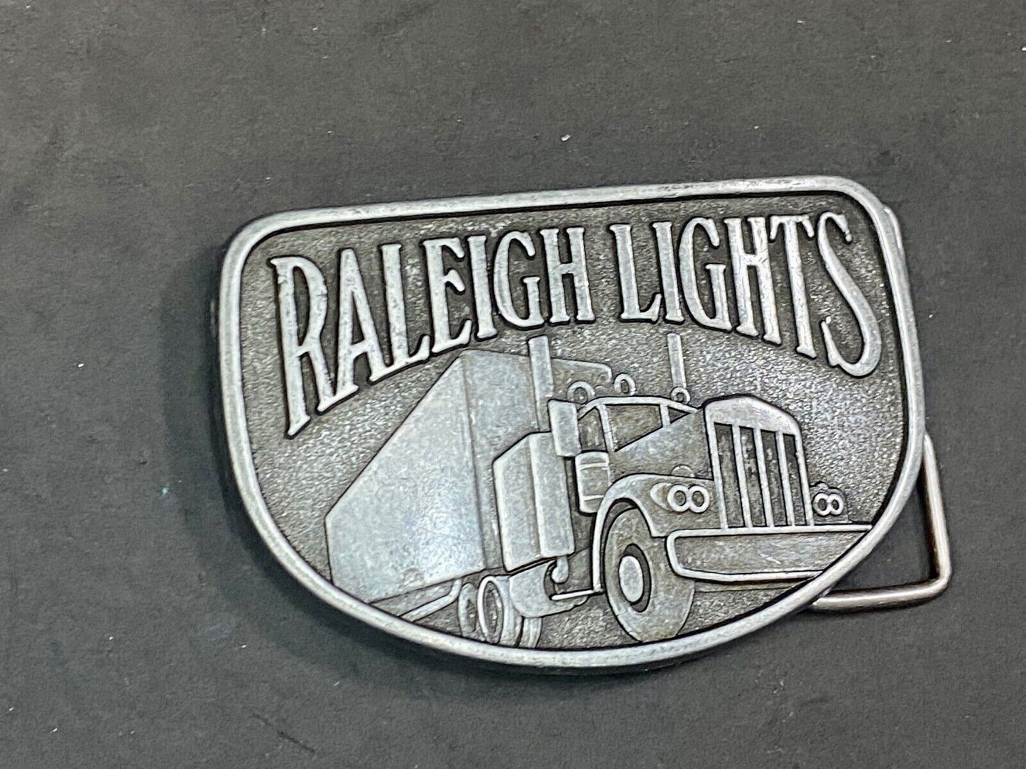 Vintage Belt Buckle Raleigh Lights Cigarette Trucker Trucking Cigarettes