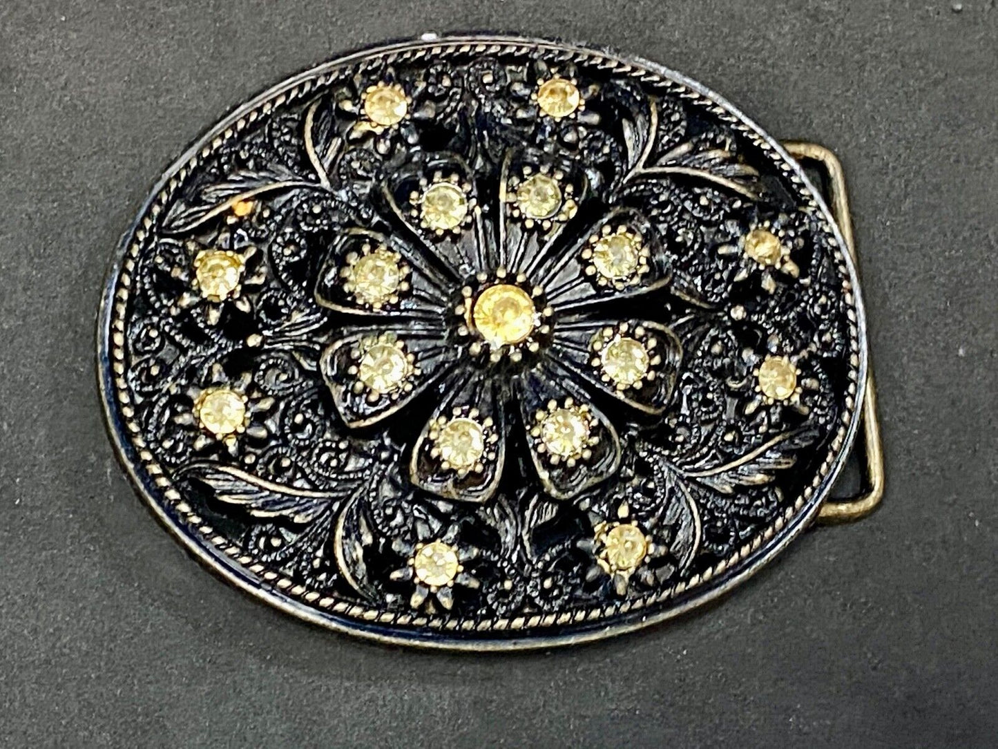 BEAUTIFUL Yellow rhinestones mounted in oval shaped flower theme belt buckle