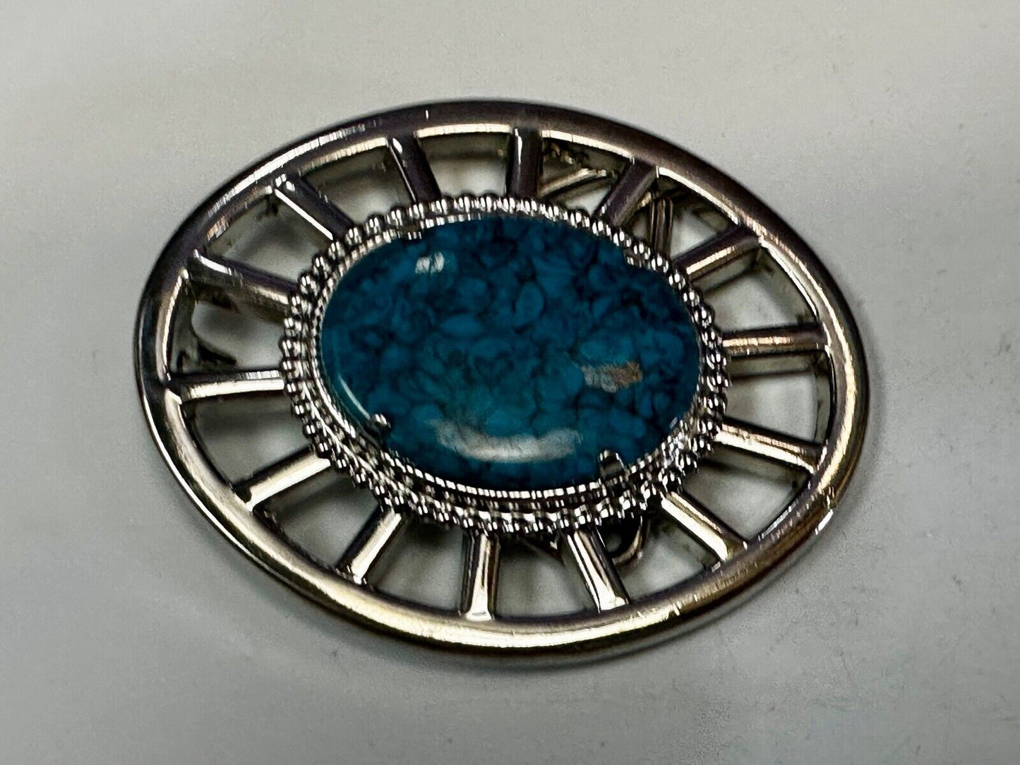 Synthetic Turquoise in unique see through silver tone round Belt Buckle