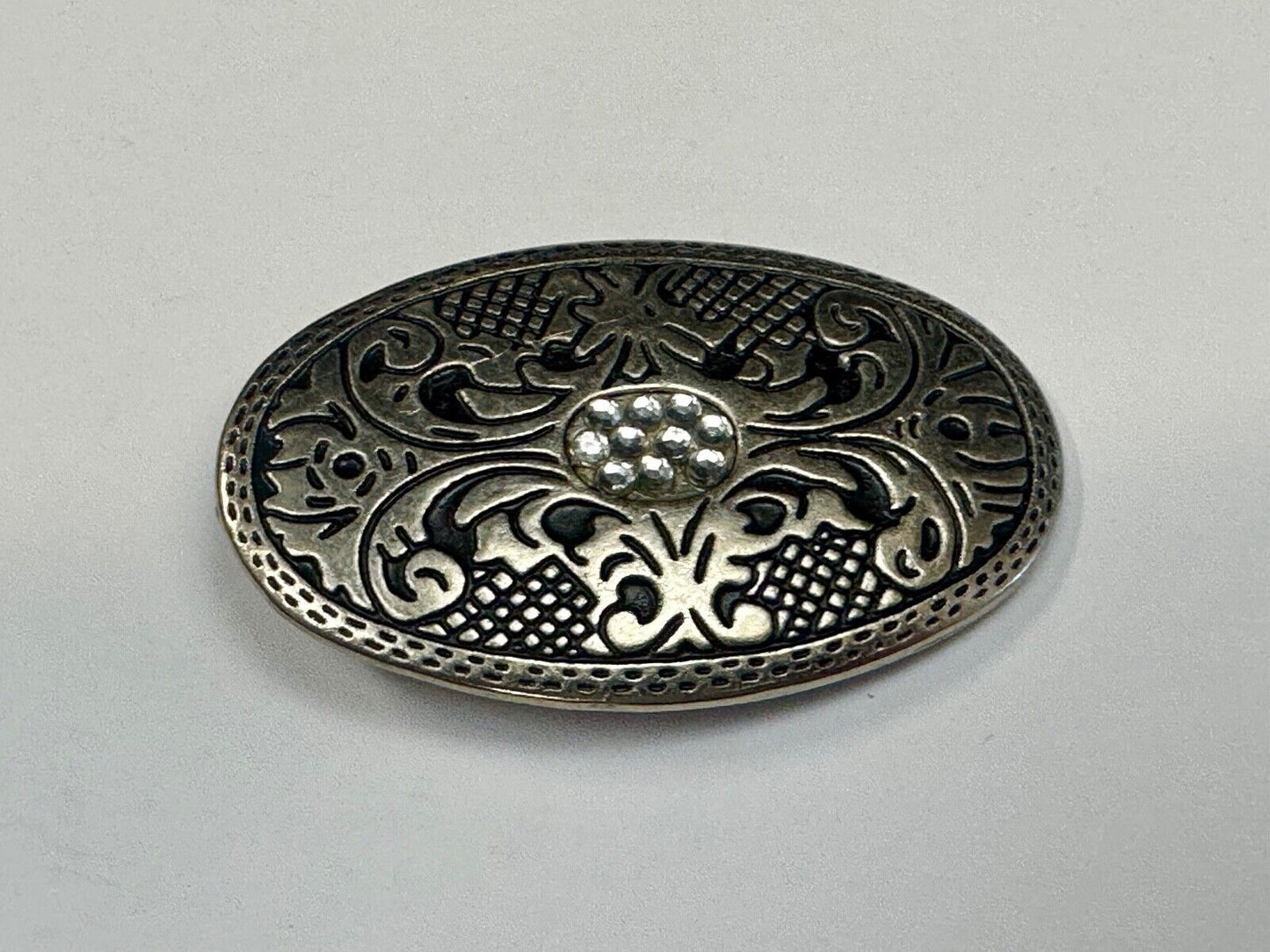 Vintage Cluster Centered in southwestern pattern oval belt buckle