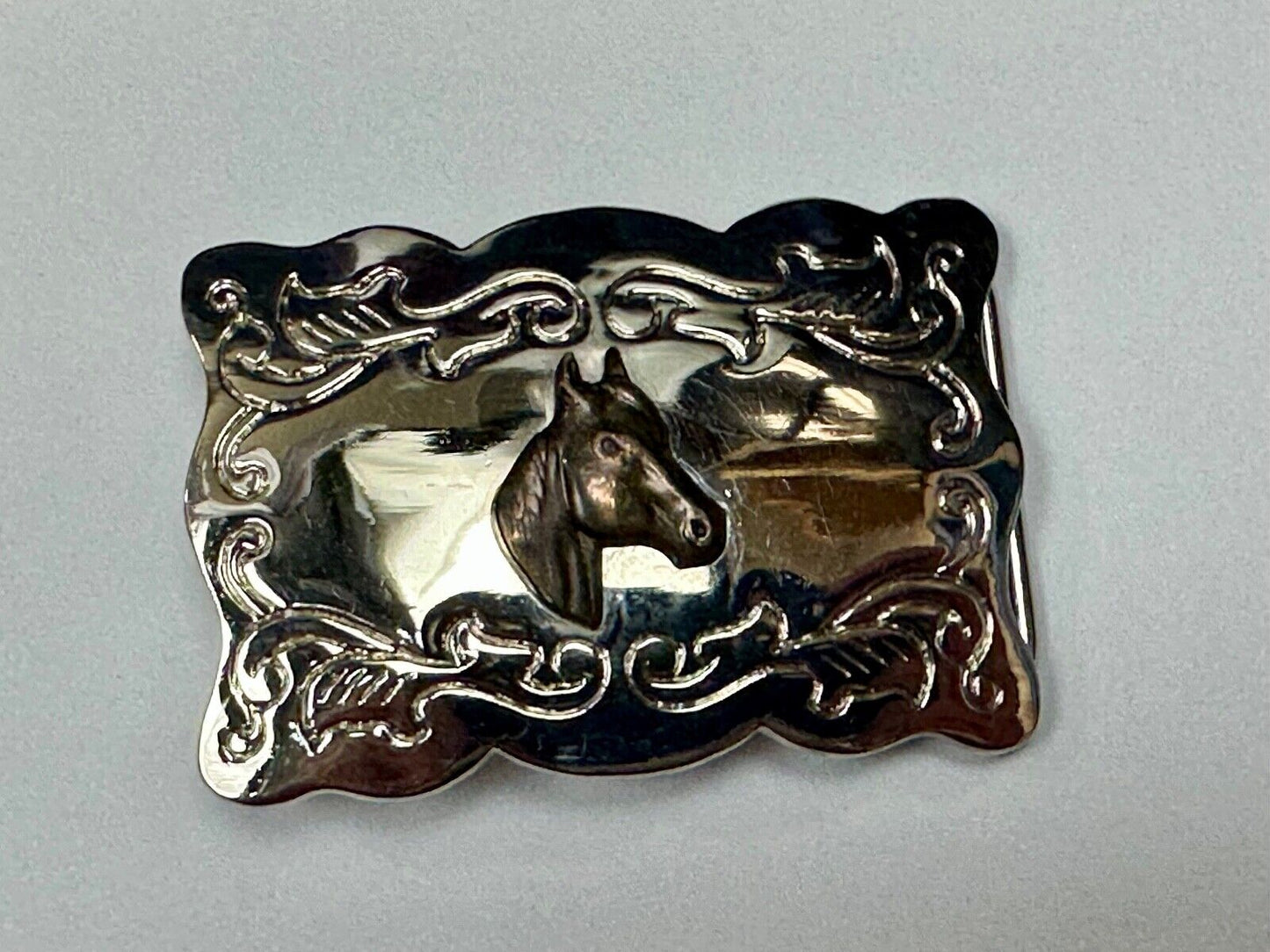 Vintage horse head centered on western rectangular two tone belt buckle