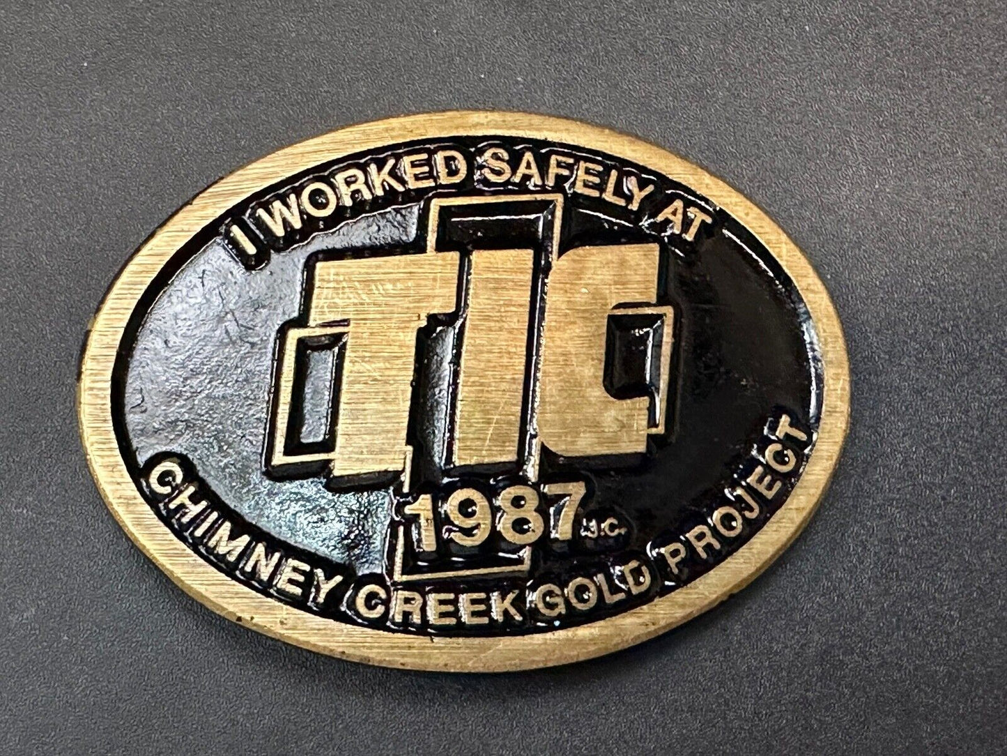 Vintage 1987 TIC Chimney Creek Gold Project Safety award brass belt buckle