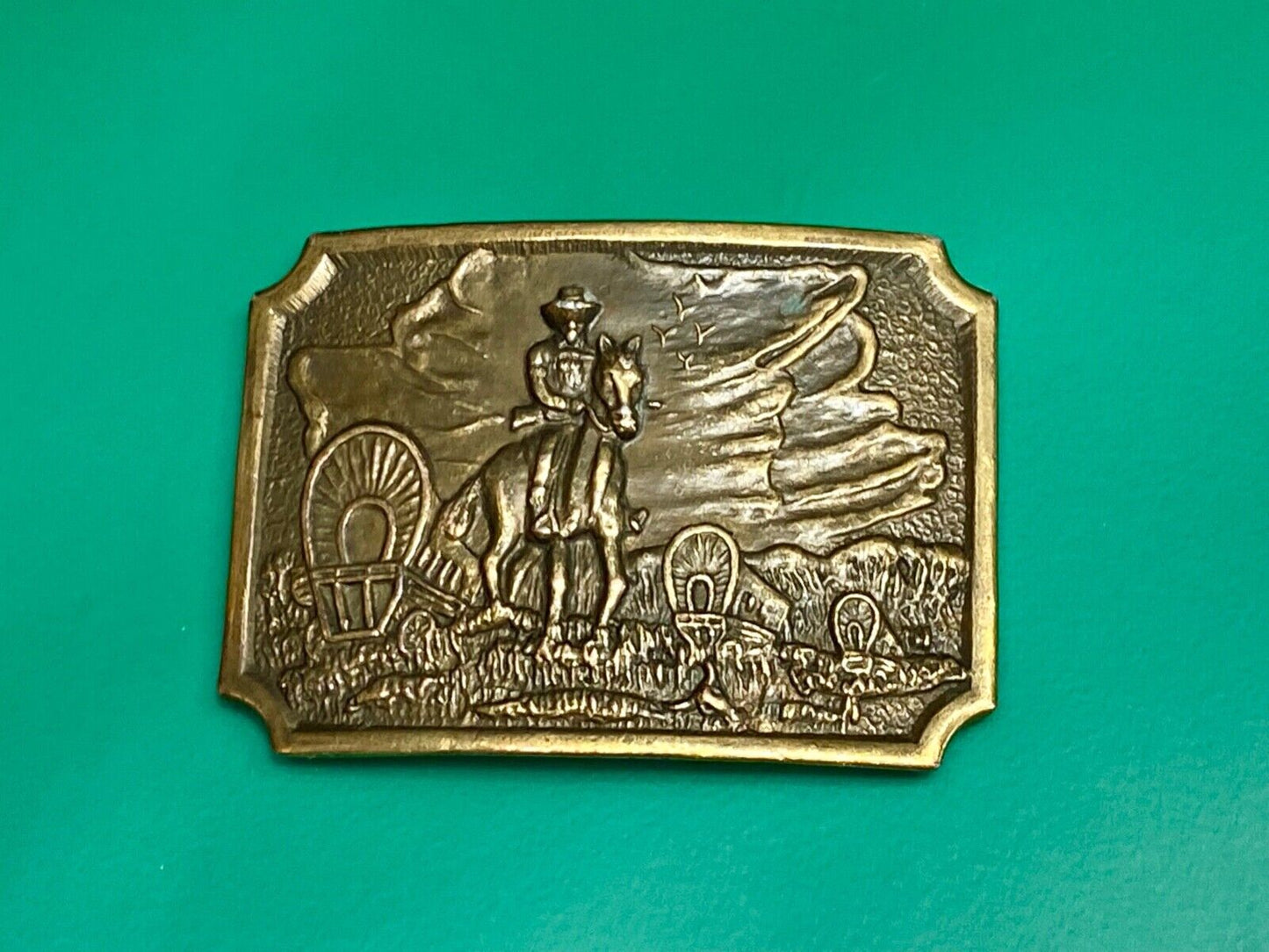 Tall in the Saddle - Covered Wagon Cowboy brass tone western belt buckle