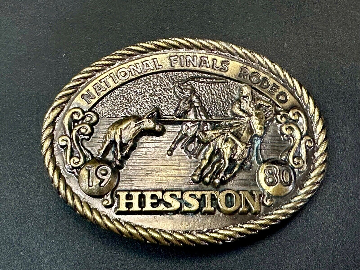 1980 NFR Rodeo Vintage Hesston Cow Roping Steer Wrestling Cowboy belt buckle