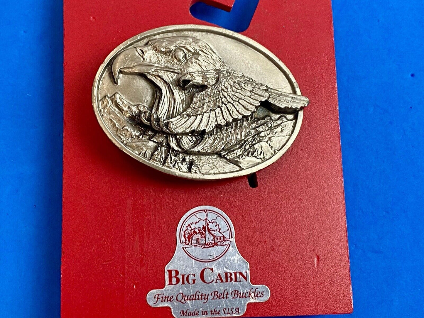 big cabin eagle head bust over mountains nature belt buckle on card