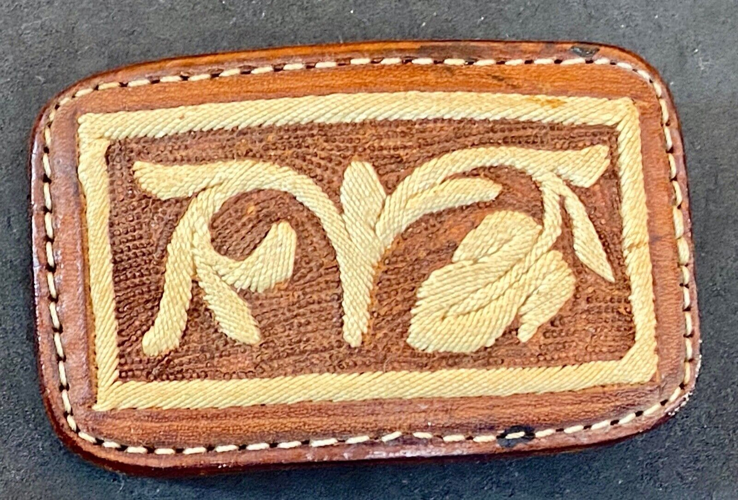 Vintage embroidered flower theme on brown leather belt buckle