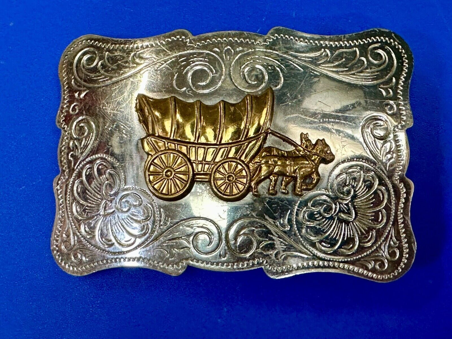 Vintage Covered Wagon two tone ornate cowboys out west flower swirl belt buckle