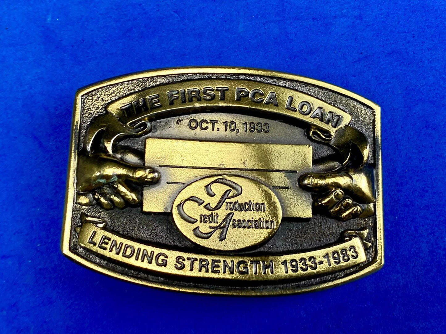The First PCA loan Production Credit Assn. The Great American Belt Buckle Co