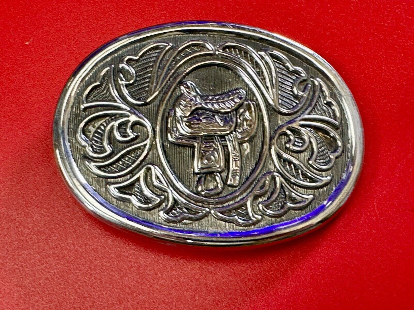 Vintage Cowboy's Horse Saddle ornate flower swirl oval belt buckle by Avon