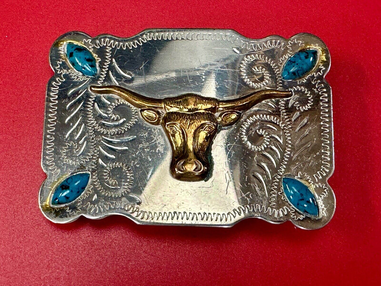The Longhorn cow steer western nickel silver belt buckle with turquoise accents