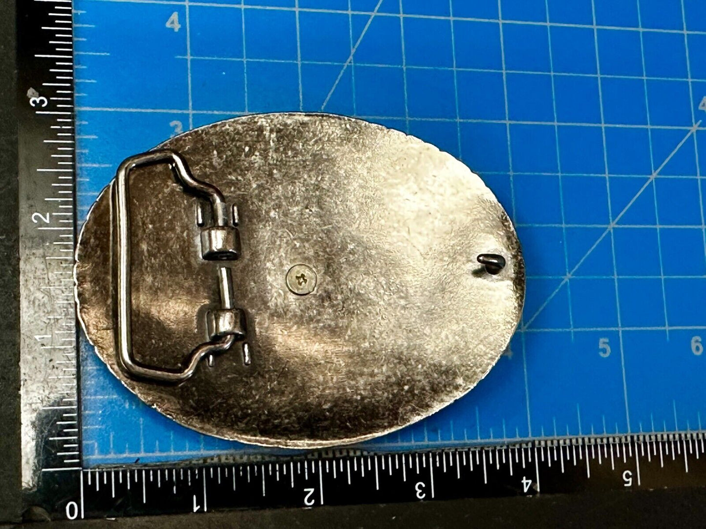 The Lone Star Centered In Oval Flower Swirl Silver Tone Belt Buckle