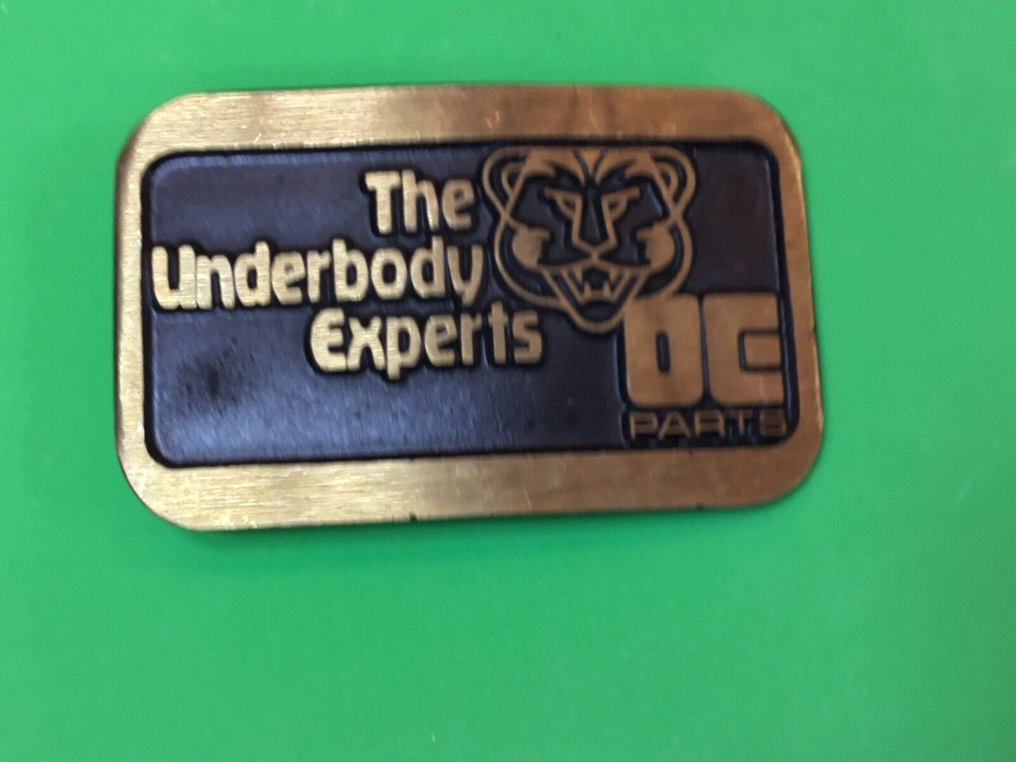 The Underbody Experts DE Parts auto car logo Promo belt buckle by Dynabuckle