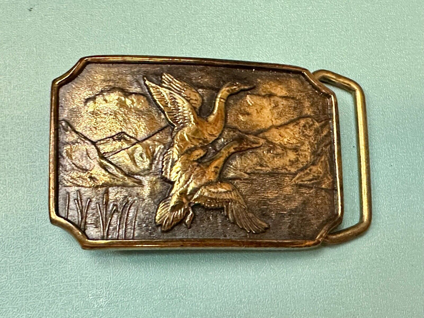 Two ducks flying from pond cat tails Nature Solid Brass belt buckle by BTS