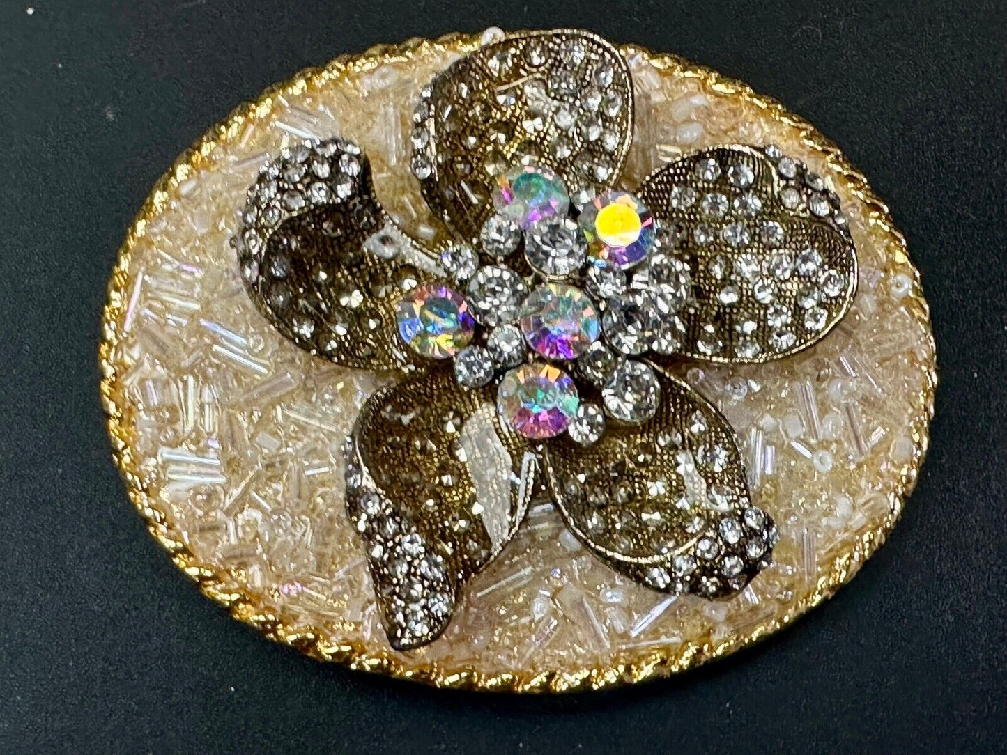 Beautiful chunky goldtone flower centerpiece in rhinestone accented belt buckle