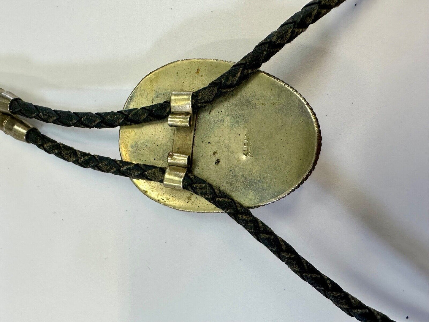 Beautiful Alpaca Mexico bolo tie with dimensional raised leaf's black stone