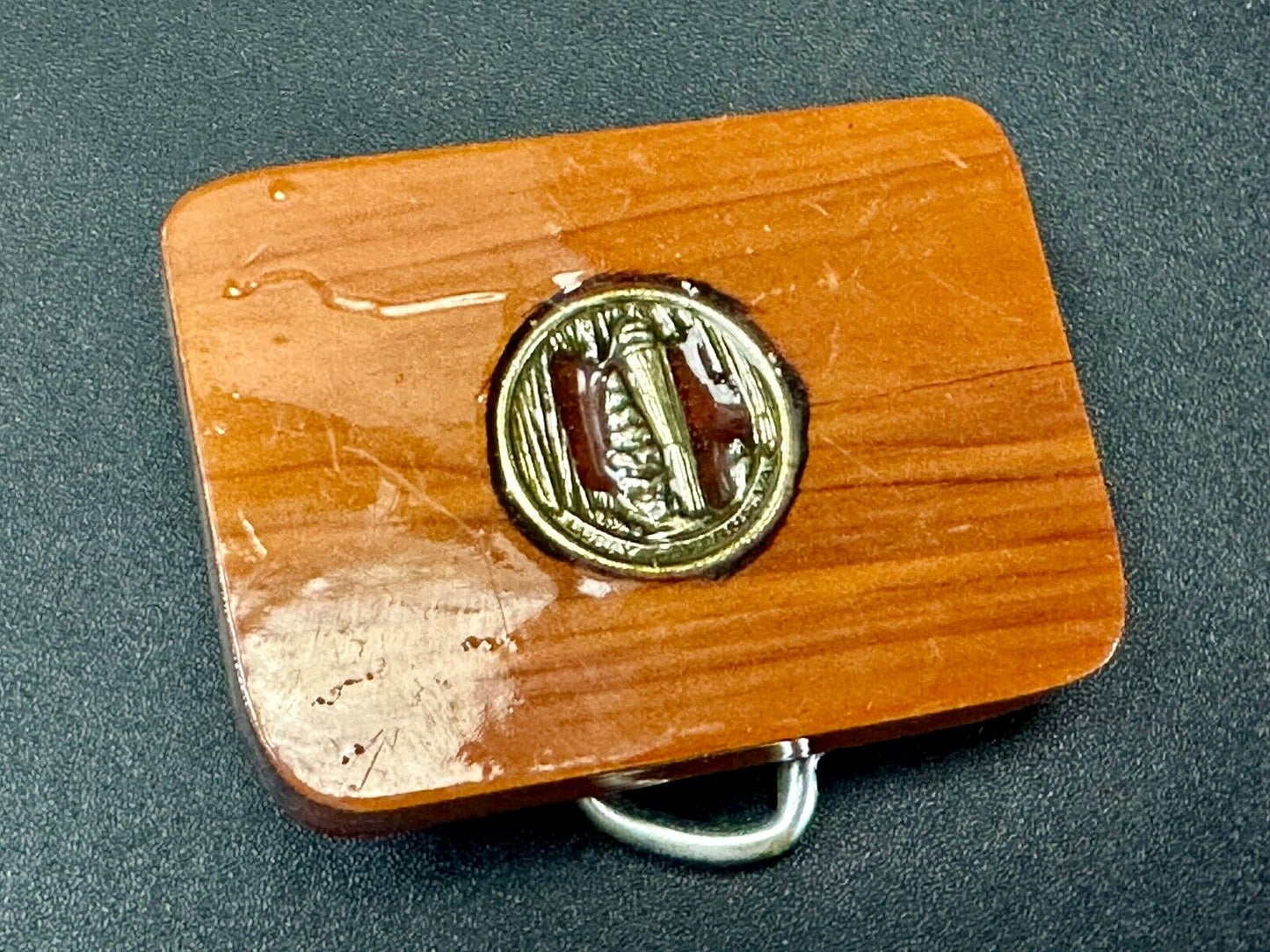 Artisan wood belt buckle with inlaid Luary Caverns cave token coin