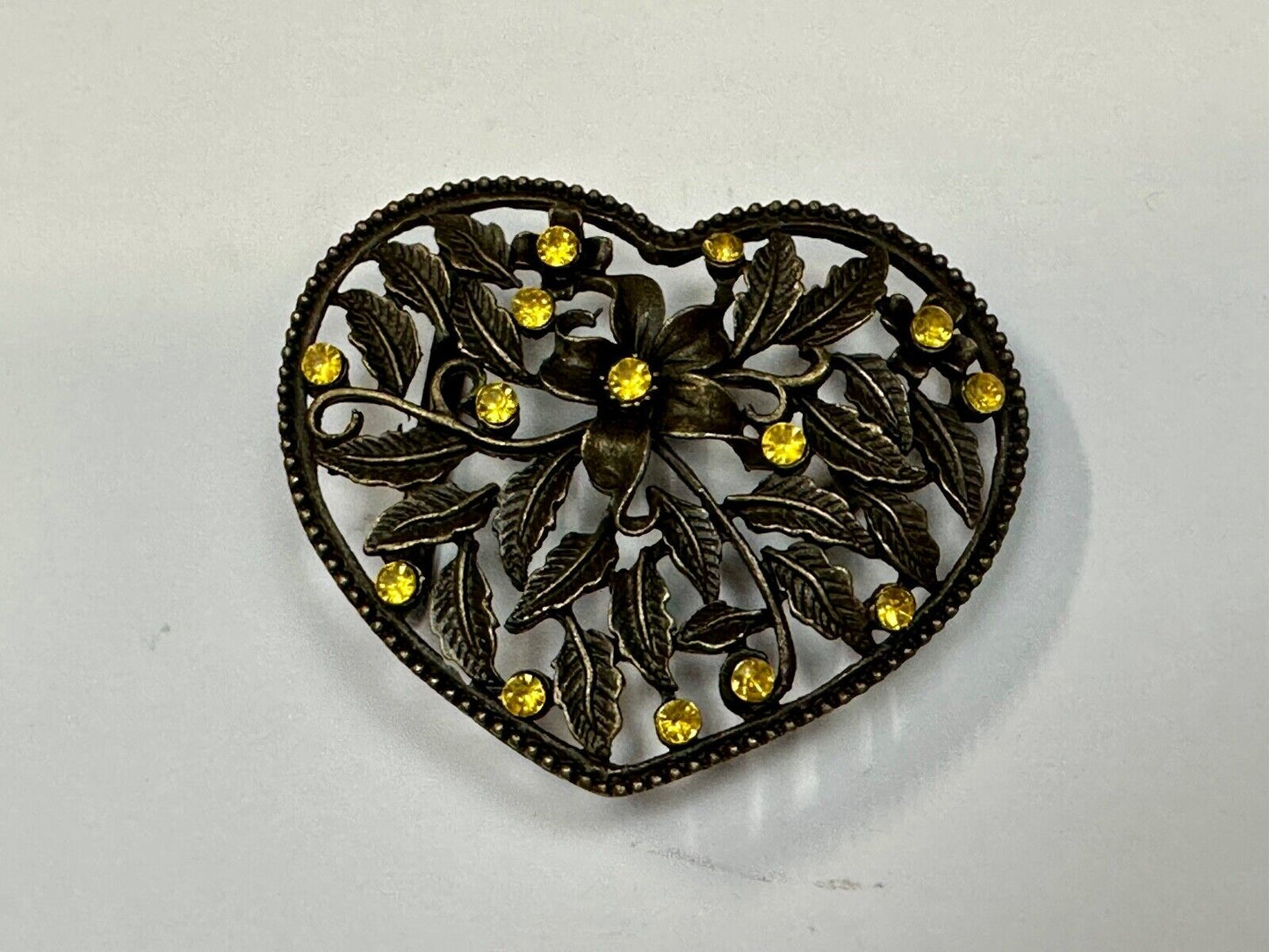 Beautiful see through Heart shaped belt buckle with yellow rhinestone accents