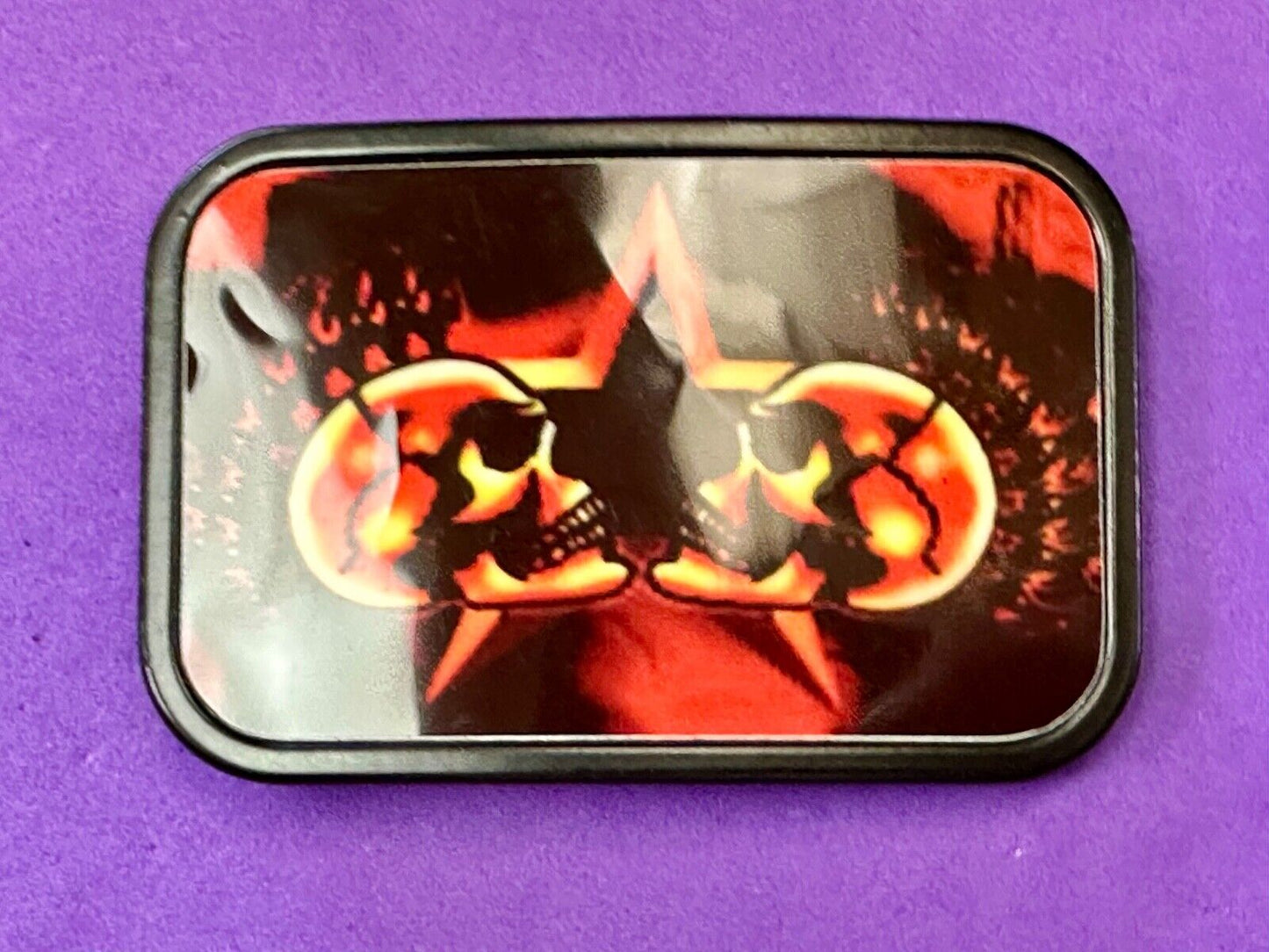 Two Skulls around star picture - black & red color rectangular belt buckle