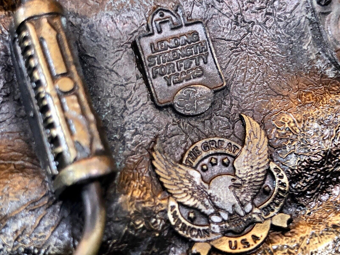 The first PCA loan belt buckle - Lending and strength production credit assn.