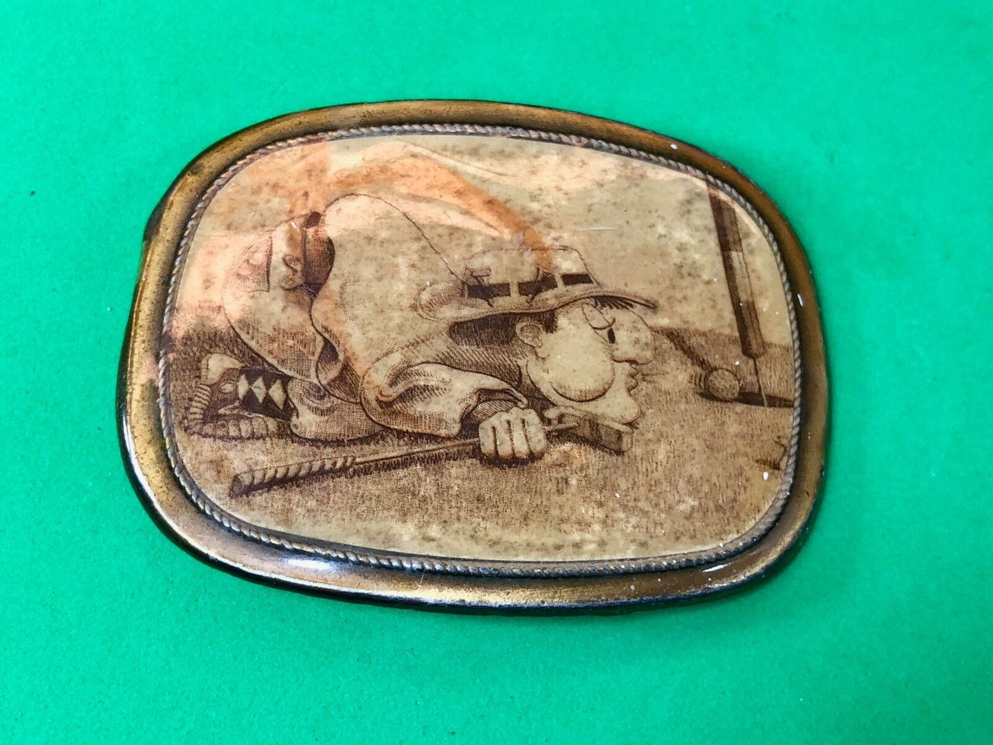 Vintage Belt Buckle, golf cartoon golfer on ground blowing ball into hole!
