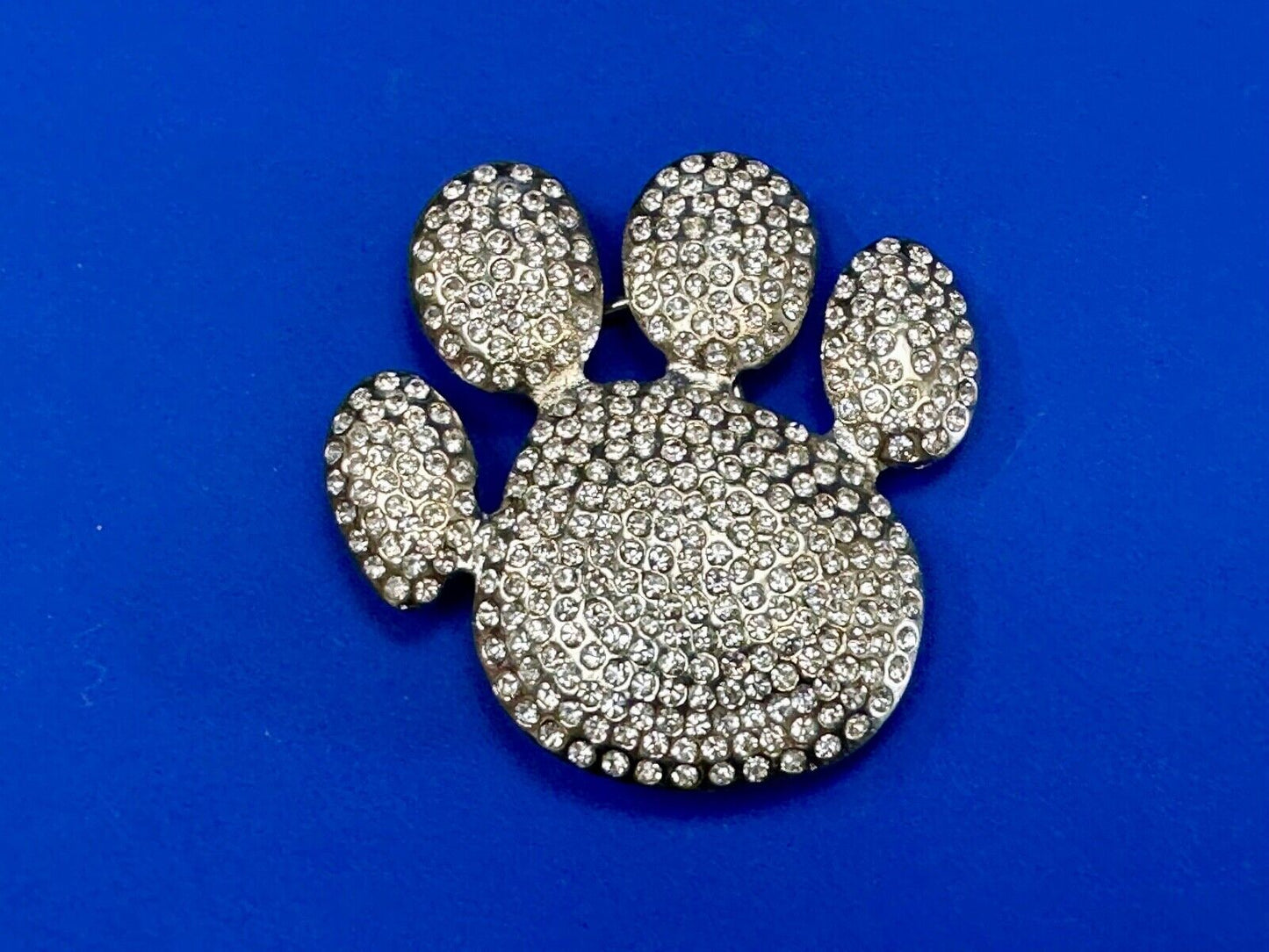 Bear Paw Print Silver Tone rhinestone covered belt buckle