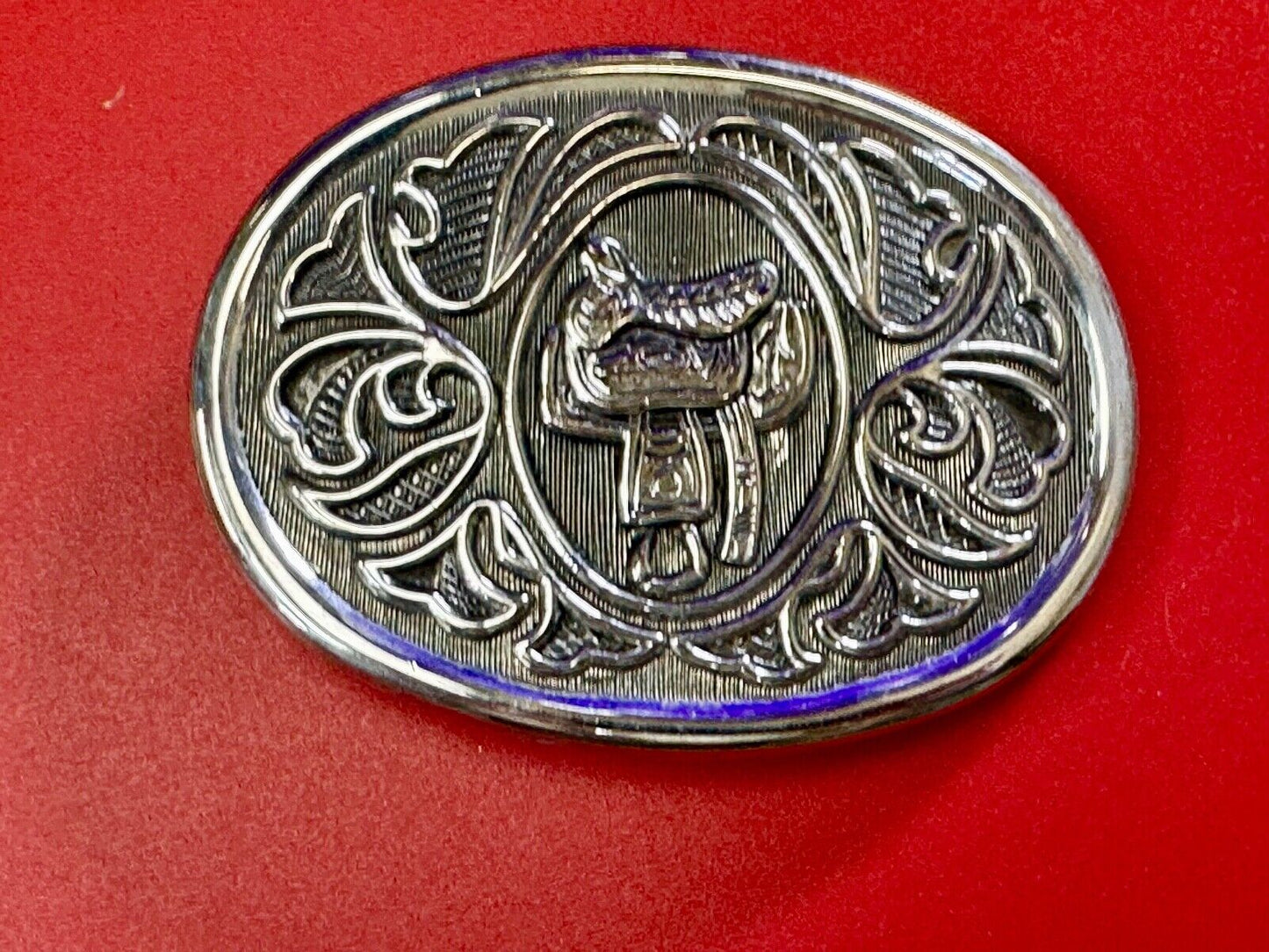 Vintage Cowboy's Horse Saddle ornate flower swirl oval belt buckle by Avon