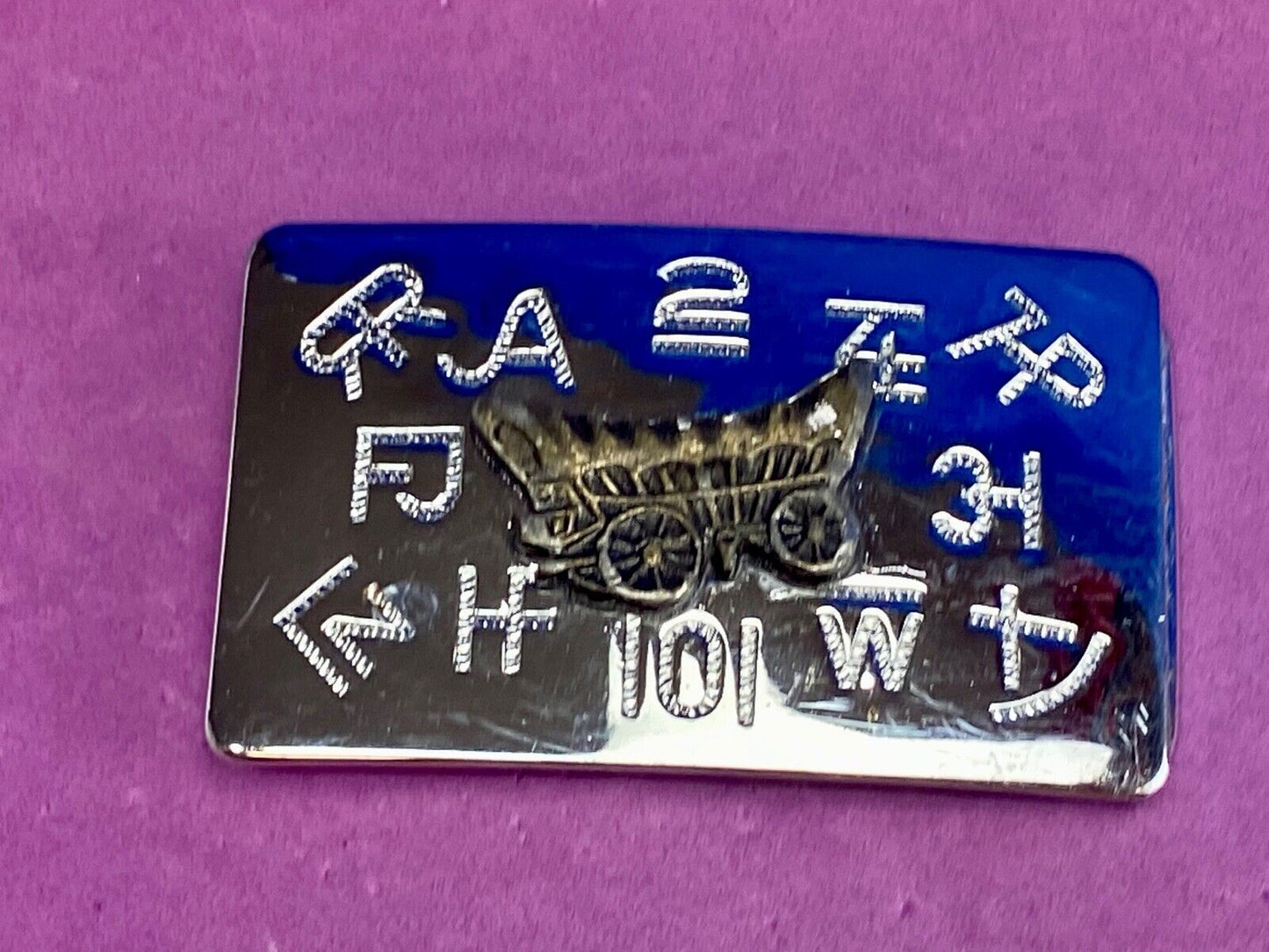 Vintage Chaimbers covered wagon western belt buckle with branding signs marks