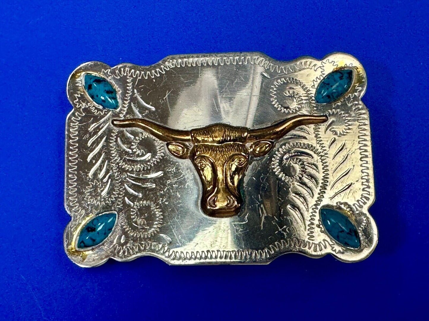 The Longhorn cow steer western nickel silver belt buckle with turquoise accents