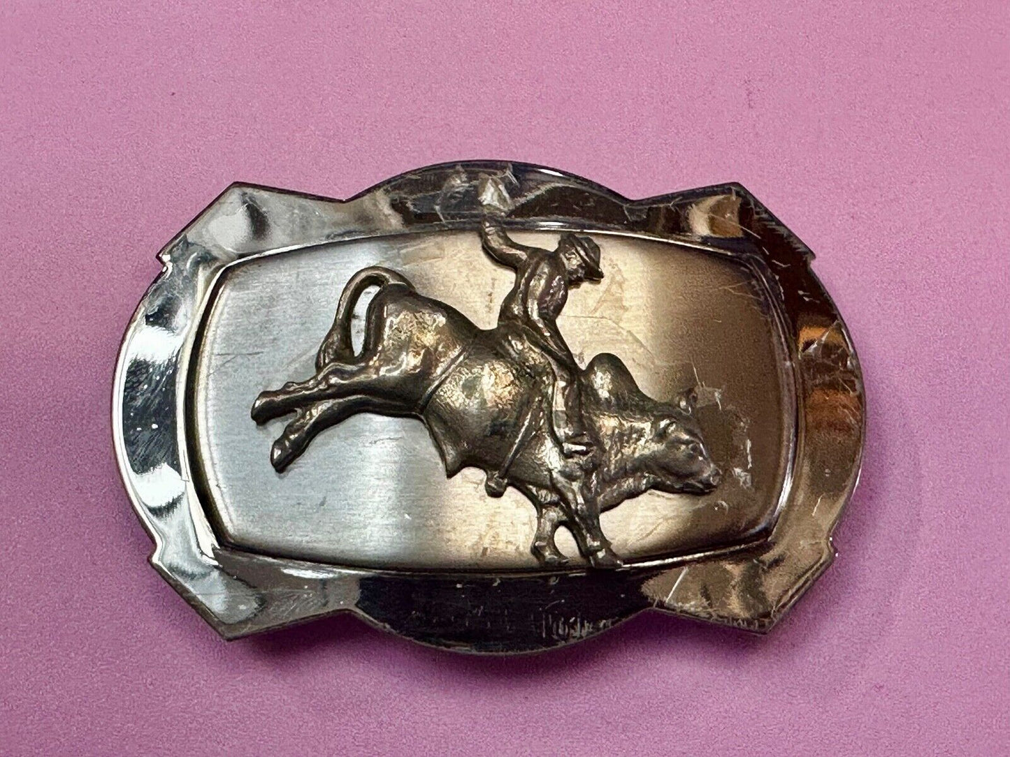 Vintage Cowboy Saddle Bronc on reflective two tone western belt buckle