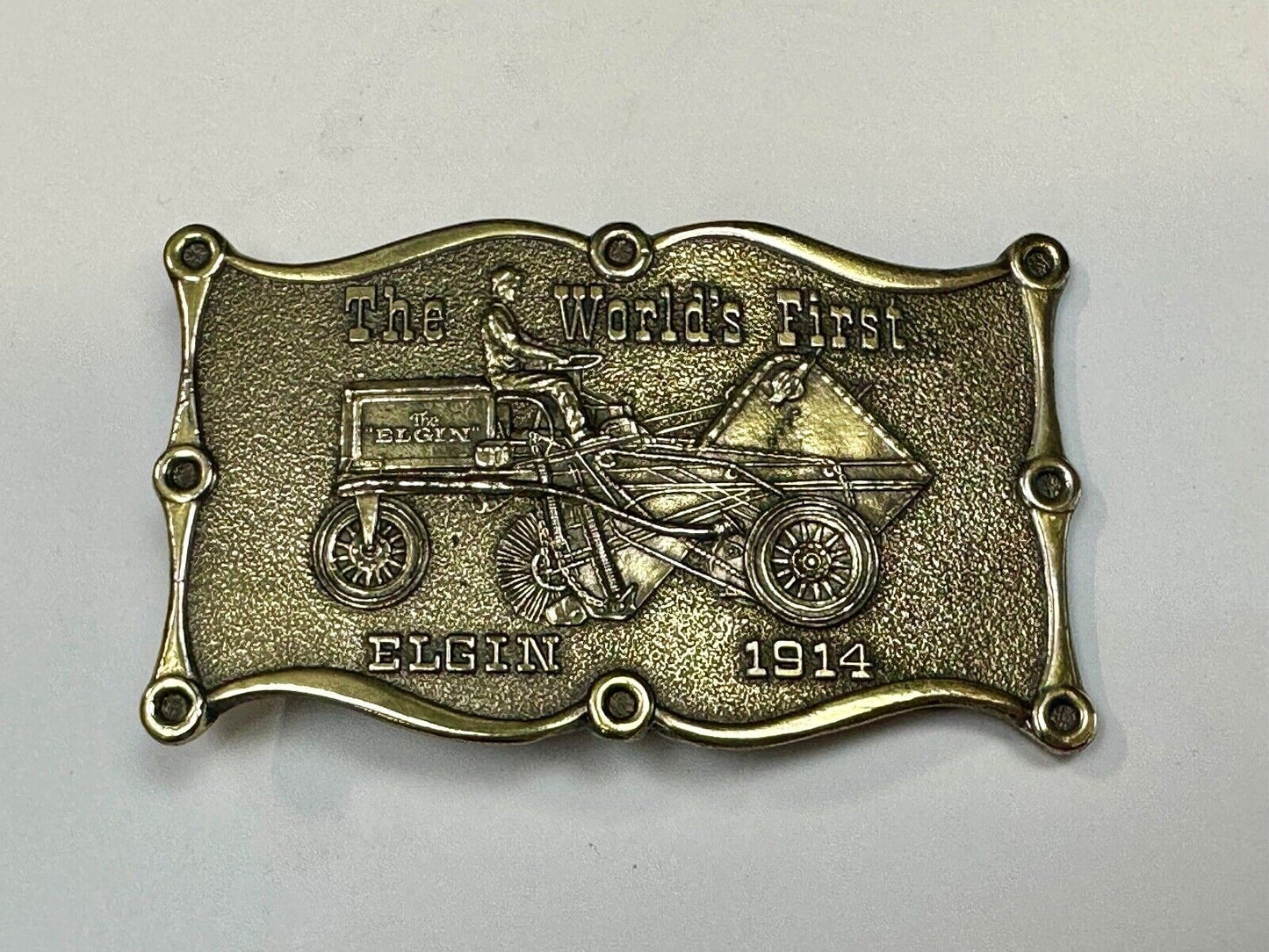 The Elgin, The worlds first tree sweeper commemorative belt buckle by Lewis