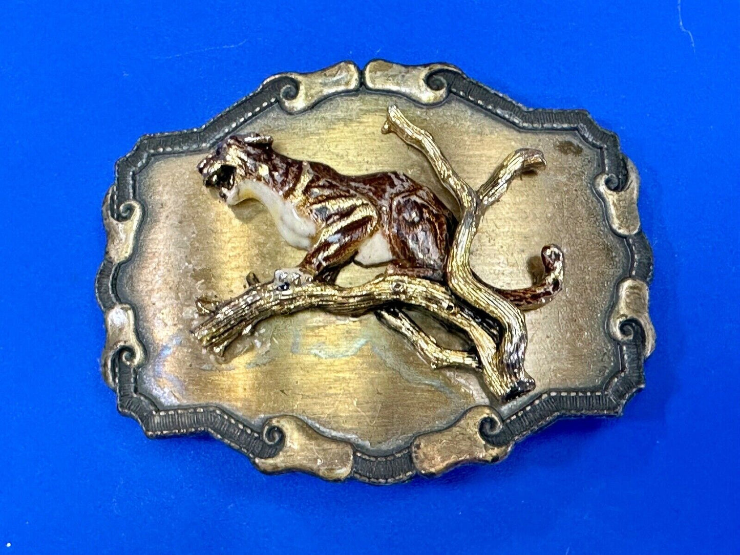 Vintage bobcat? leaping from branch western framed belt buckle by Raintree