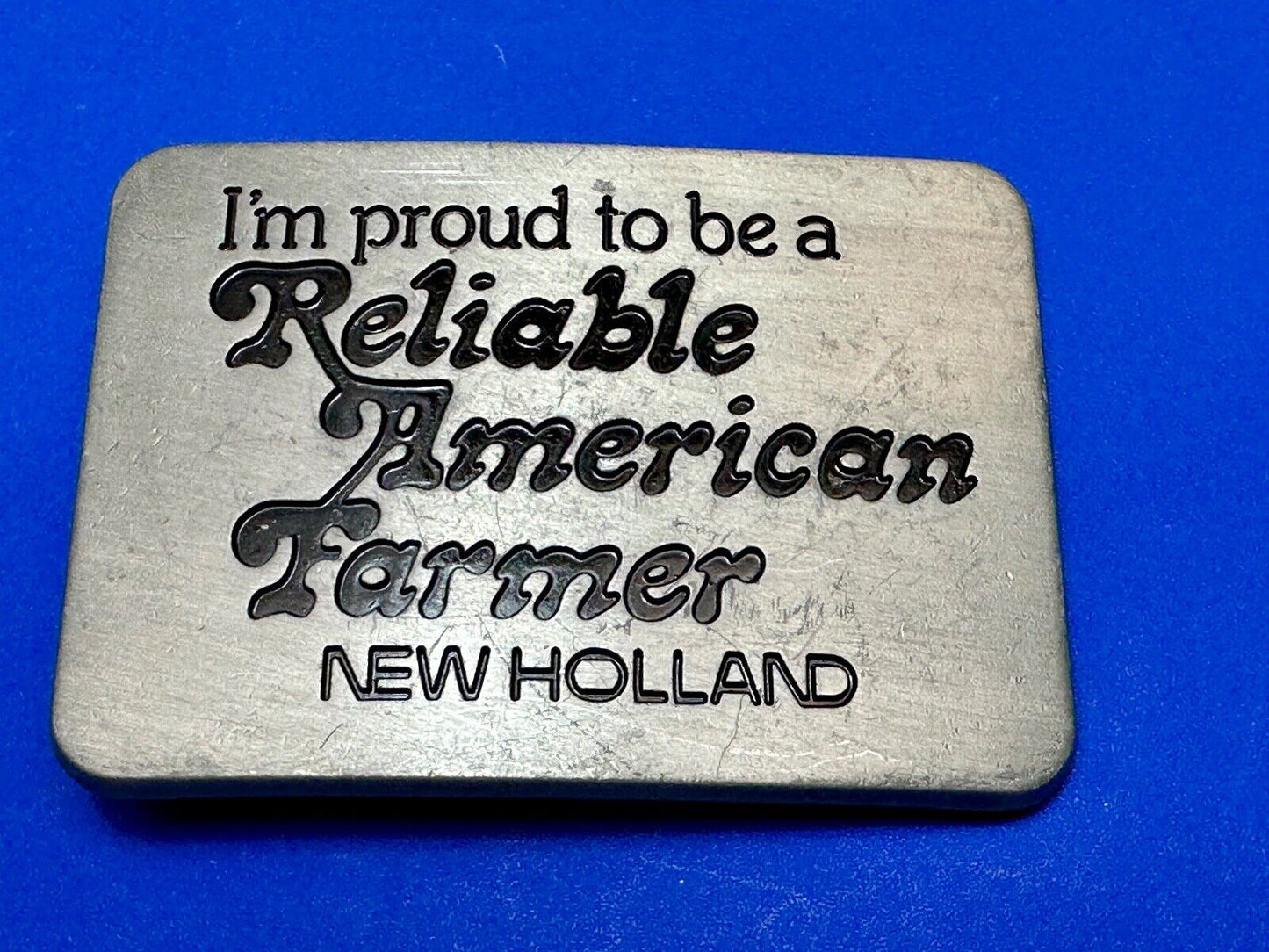Vintage 1982 NEW HOLLAND I'm Proud to be a Reliable American Farmer Belt Buckle