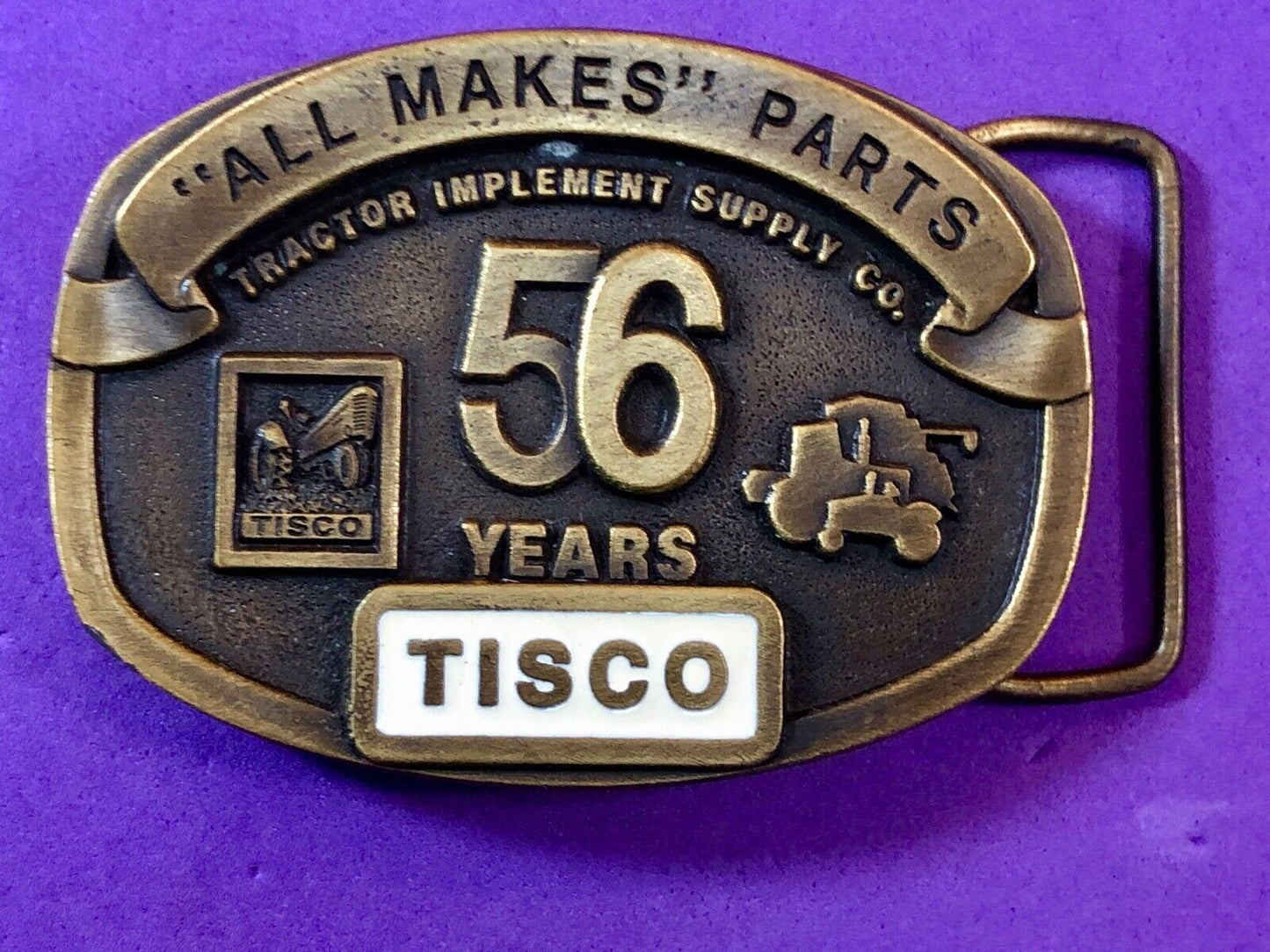 TISCO - 56 years tractor farming parts supply store advertising belt buckle